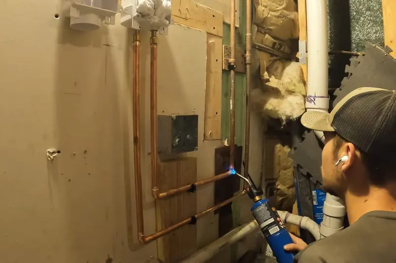 Basement rough-in plumbing with exposed drain and supply lines for Basement Plumbing in Castle Rock, CO in Castle Rock, CO
