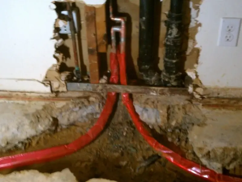 Pex and copper pipe fitting connection during repiping work for Repiping & Whole-Home Pipe Replacement in Castle Rock, CO in Castle Rock, CO