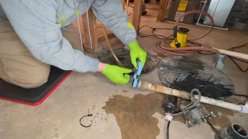 Sump pump pit with discharge piping and float components for Plumber in Crystal Valley Ranch, Castle Rock, CO