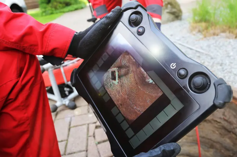 Technician using electronic leak location equipment outside for Leak Detection in Castle Rock, CO | Electronic & Acoustic